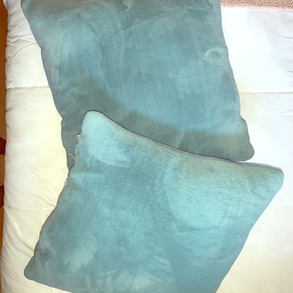 2 super soft turquoise throw pillows